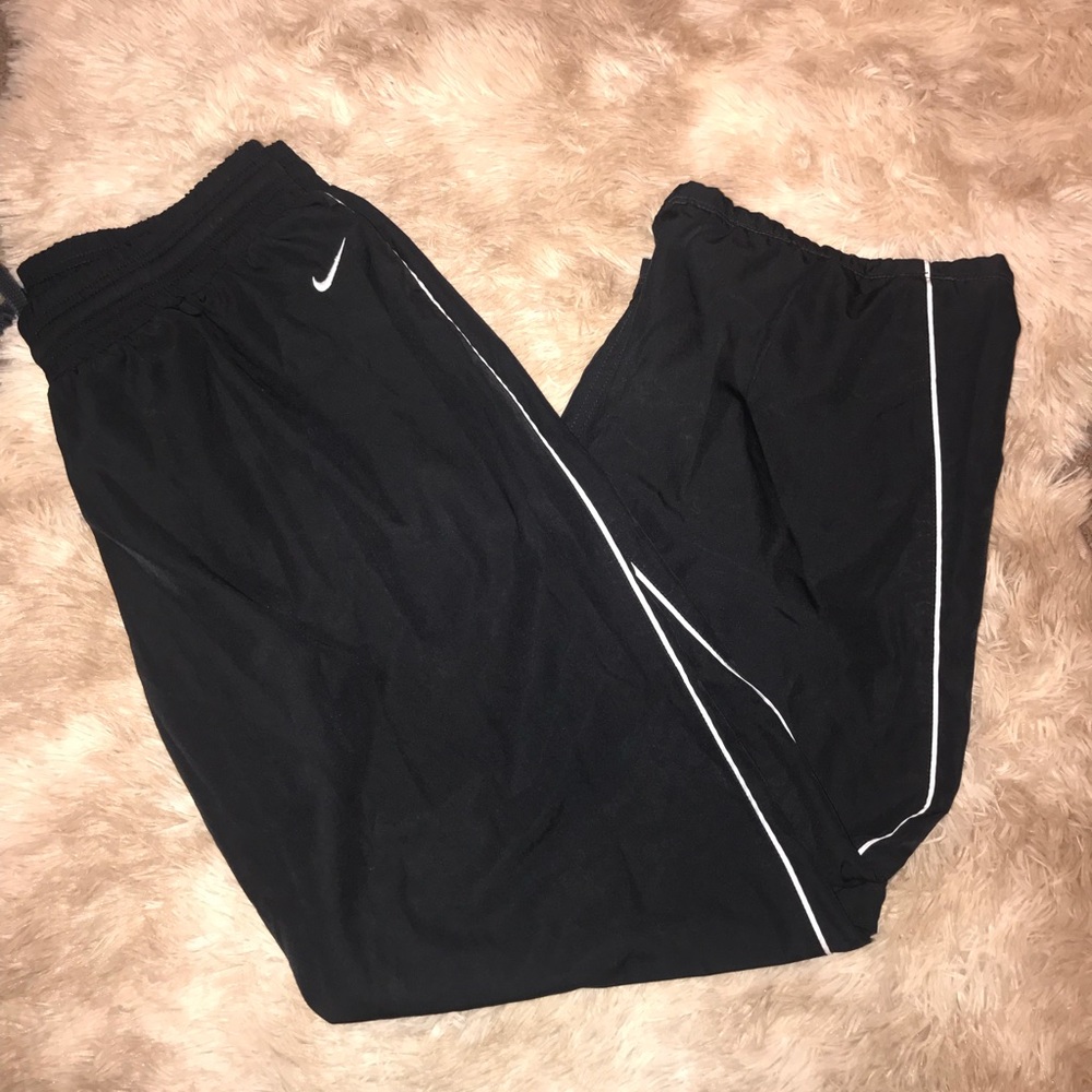 Black Nike sweat pants with a touch of white